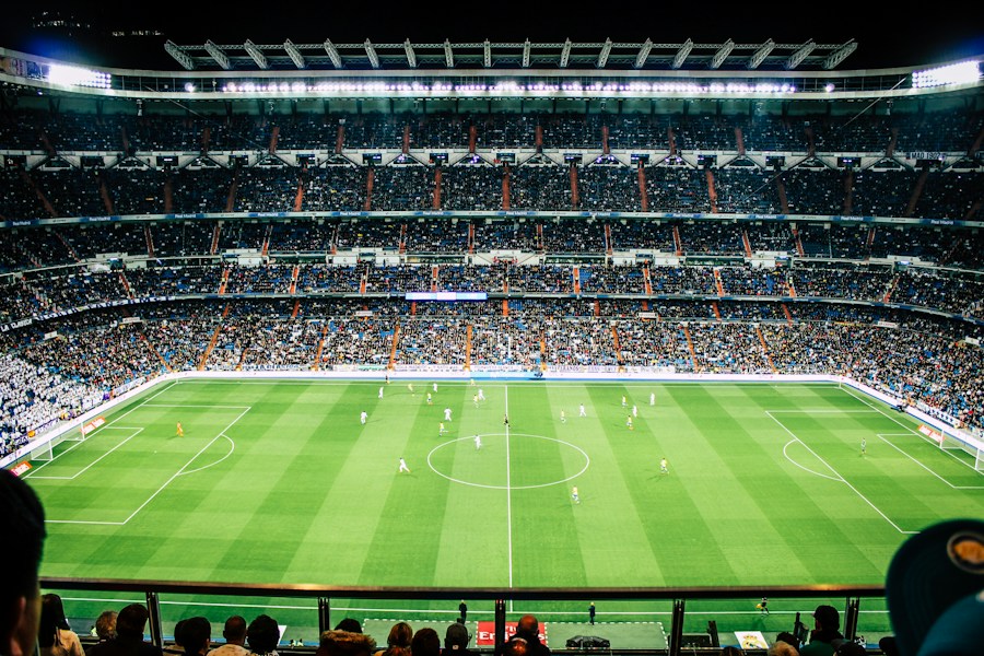 Football stadium under bright floodlights